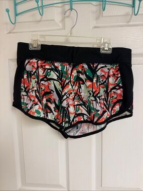 Under Armour Black Floral Camo Print Athletic Shorts with Red & Green Accents